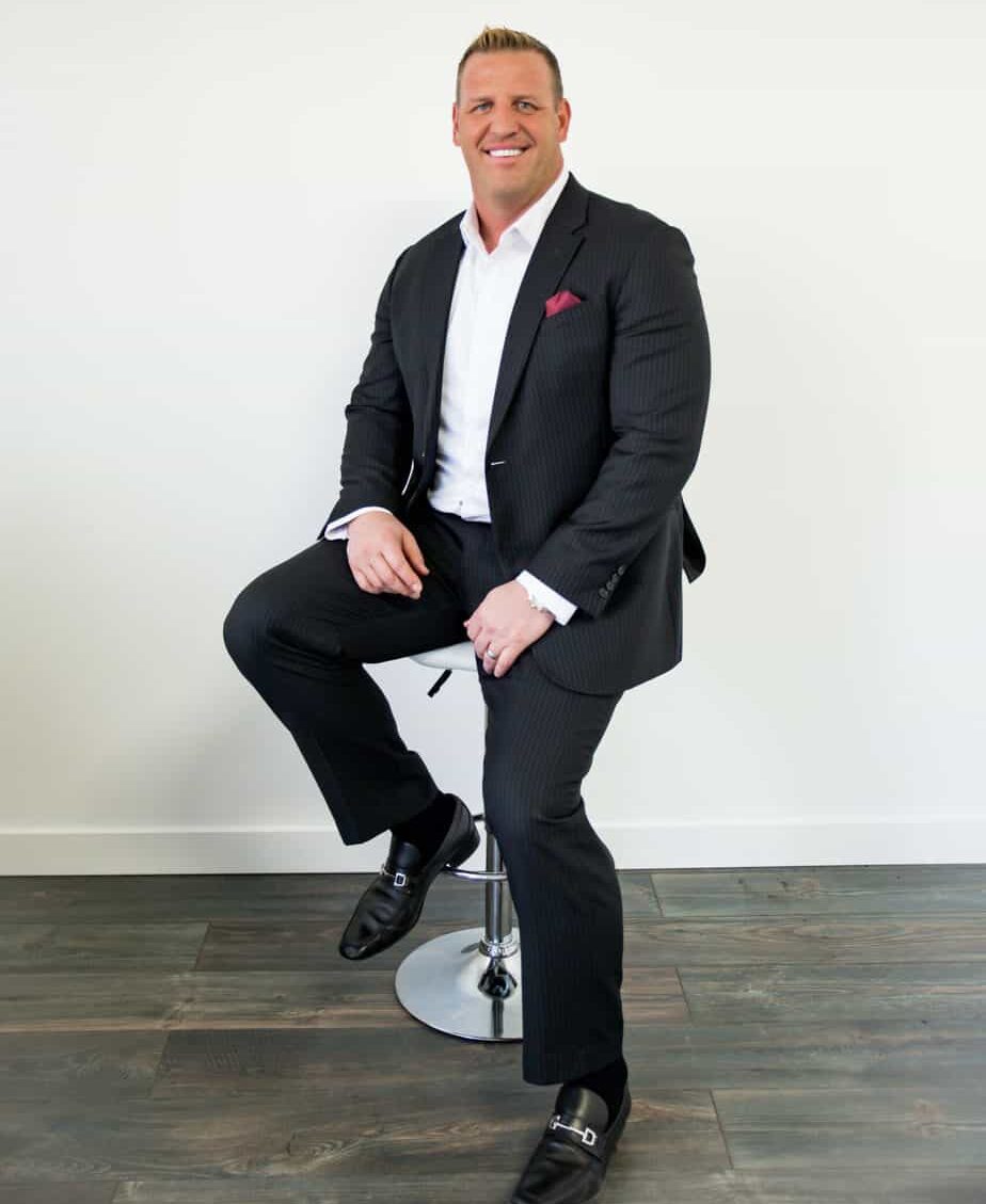 Brad Winget sellers agent utah professional photoshoot sitting on a barstool